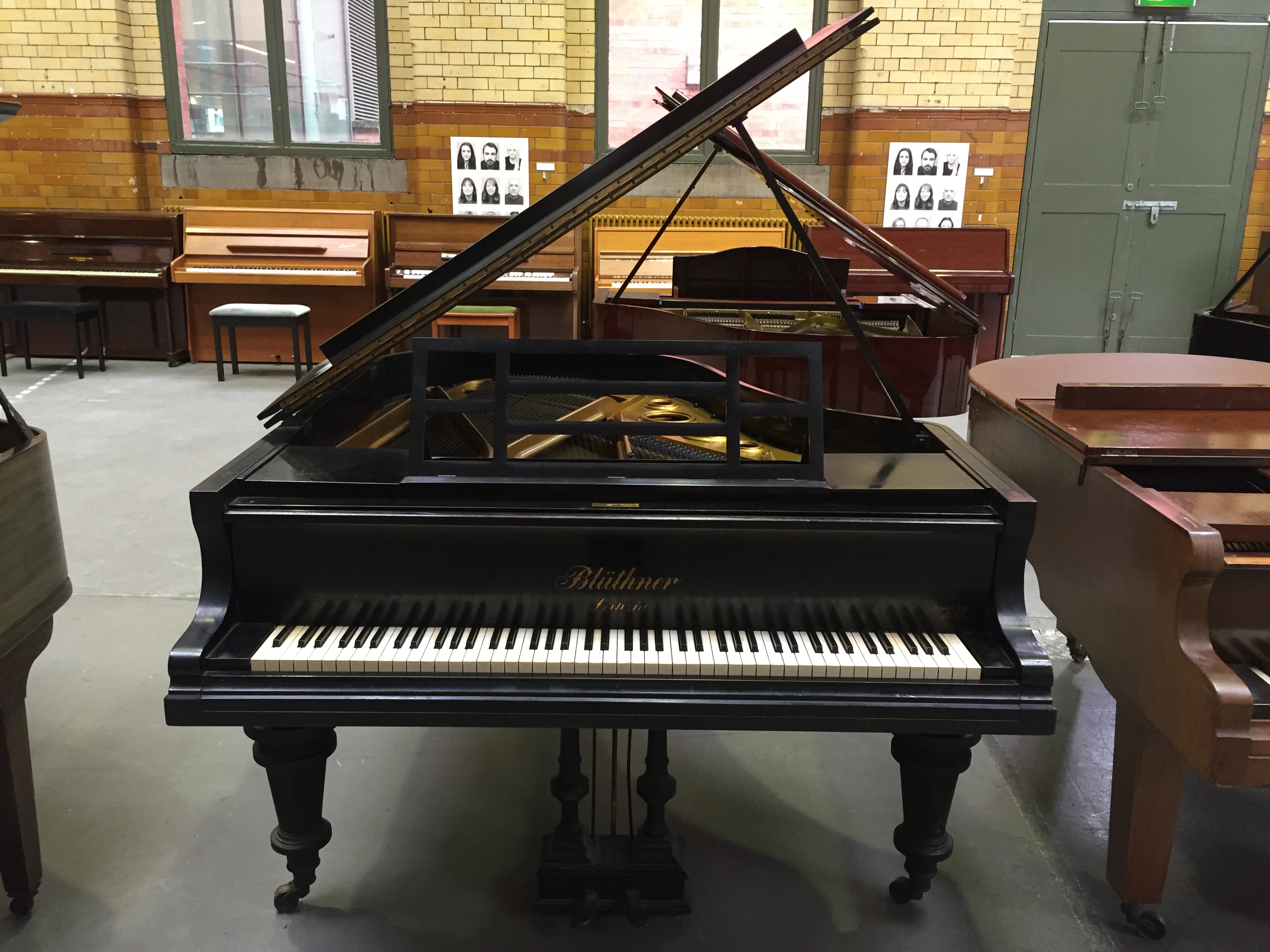 Bluthner C.1913 A 5ft 8 grand piano in an ebonised case raised on turned and fluted legs.