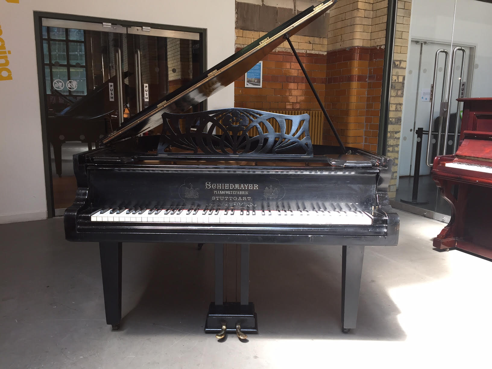 Schiedmayer      C.1900 A 6ft 4 grand piano in an ebonised case raised on square tapered lags.