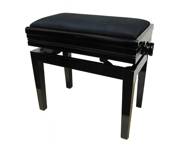 An adjustable piano stool raised on square tapered legs and finished in a black velvet upholstery