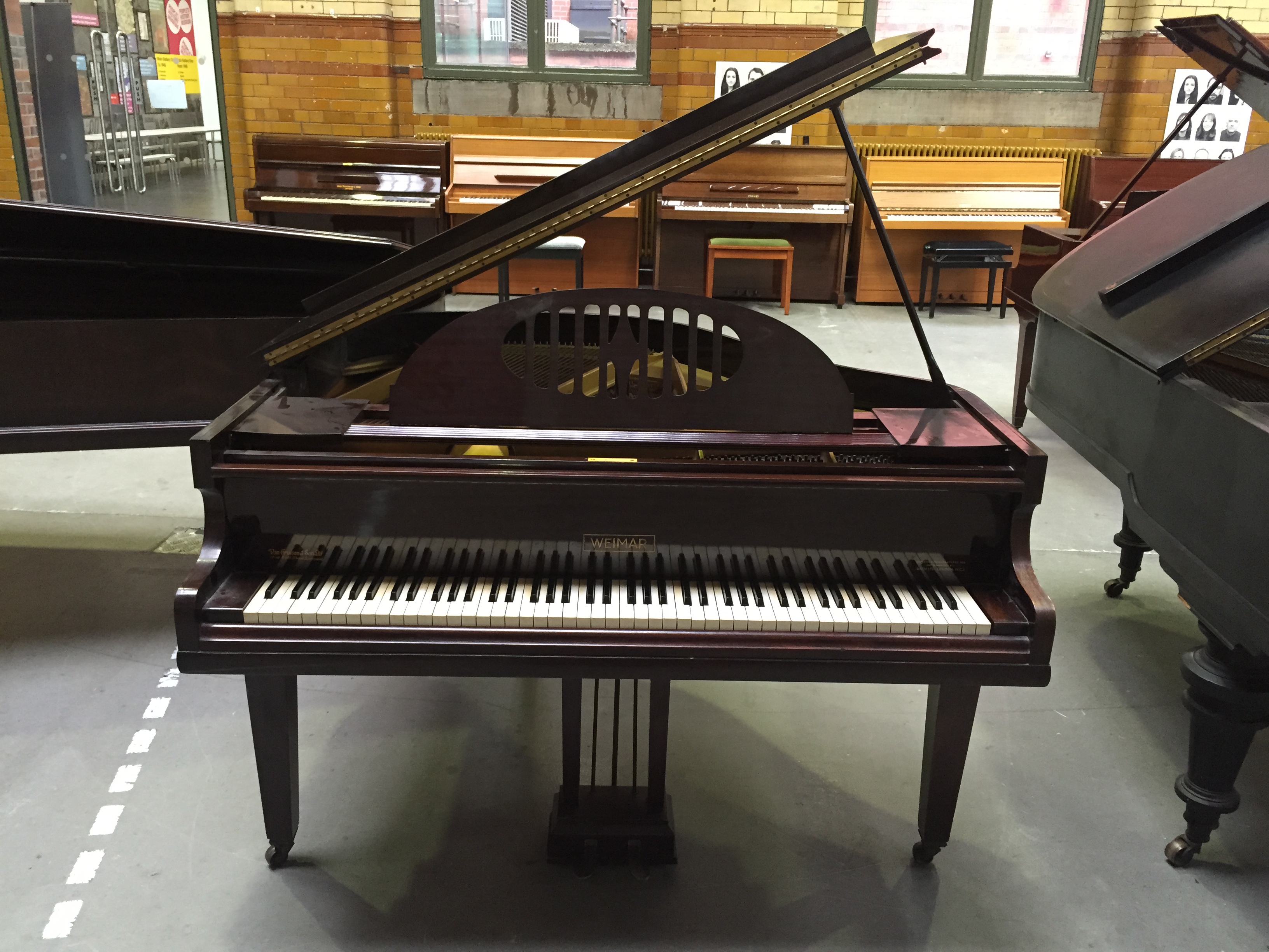Weimar C.1939 A 4ft 7 grand piano in a mahogany case raised on square tapered lags