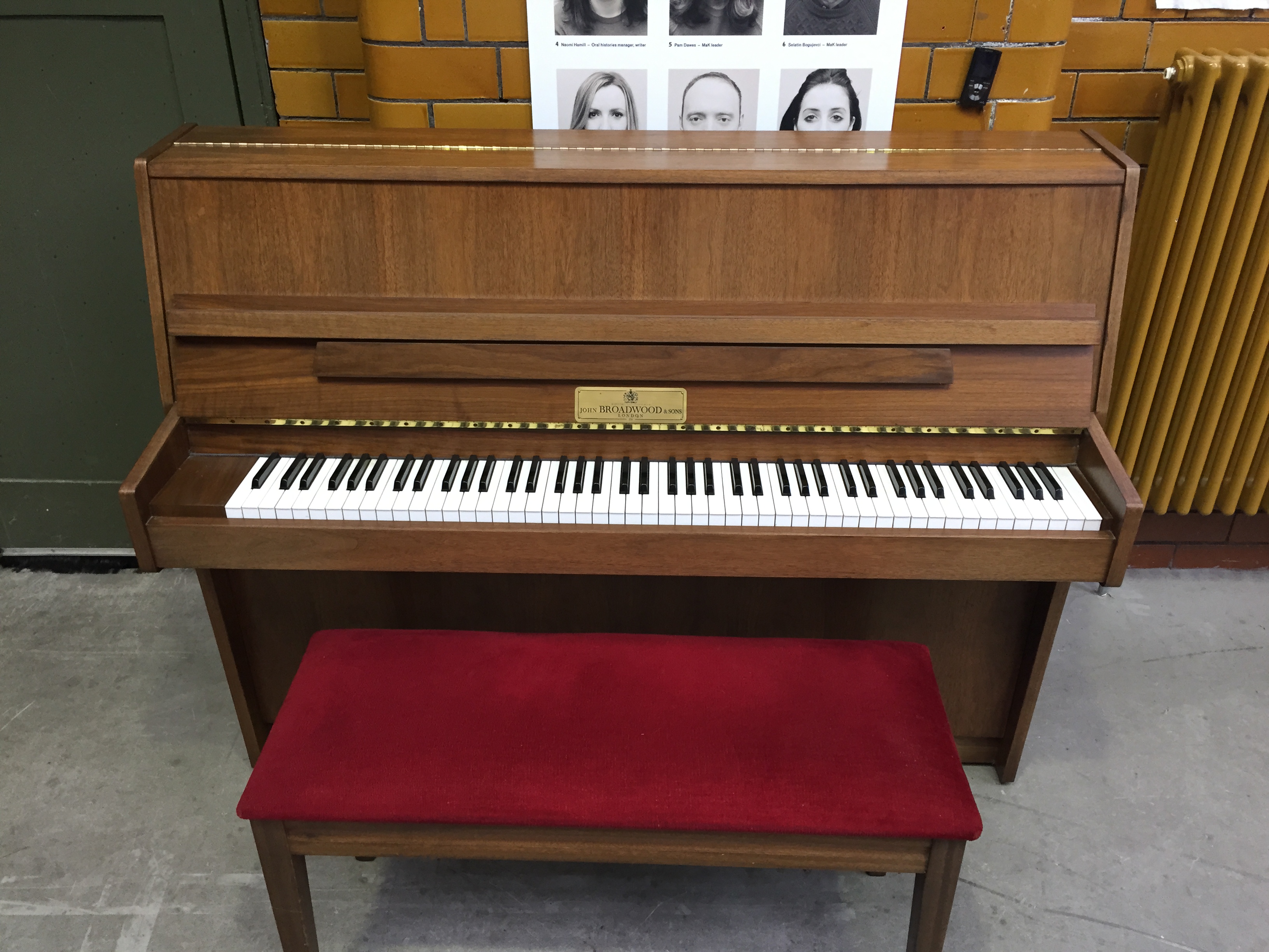 Broadwood C.1982 A modern upright piano in a Walnut satin case.