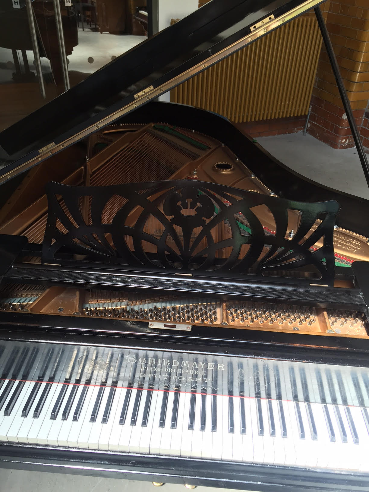 Schiedmayer      C.1900 A 6ft 4 grand piano in an ebonised case raised on square tapered lags. - Image 2 of 4