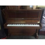 Bechstein    C.1899 A Model 10 upright piano in a rosewood case.