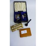 Black leather jewellery box containing pen knives, magnifying glass, pipe, lighters etc, together