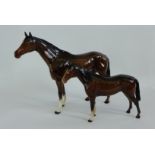 A large Beswick figure of a brown horse in a high gloss glaze together with another smaller (2)