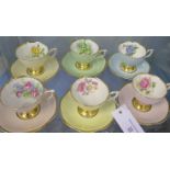 Clare bone china harlequin cups and saucers, each with a different floral spray to cup interior (