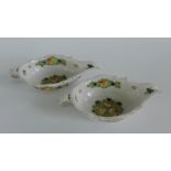 A pair of French Faience sauceboats, each painted with fruit and flowers (2) 23cm long