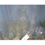 Twelve early 20th century etched glass beakers together with a decanter and a small water carafe and