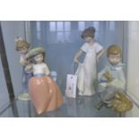 Four Nao Spanish porcelain boy and girl figures (4) tallest 22cm high