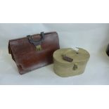 A vintage brown leather briefcase and a vanity case (2)