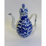 Chinese blue and white tea or wine pot, painted with stylised foliage to the body and lid (with