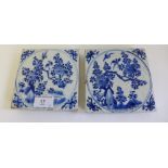 A pair of Chinese blue and white thickly potted square tiles, each painted with a circular panel