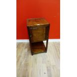 A 19th century mahogany bedside cabinet having a panel door cabinet raised on squared supports, 36 x