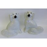 A pair of white glazed Staffordshire chimney spaniels (2) 29cm high