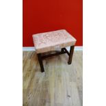 A contemporary upholstered Whytock  & Reid mahogany framed stool