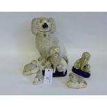 A collection of six 19th century Staffordshire fritwork figures to include spaniels and lambs