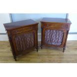 A pair of reproduction mahogany side cabinets having moulded tops over long drawers and panel doored