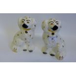 A pair of Beswick white glazed and gilded chimney spaniels (2) 20cm high