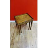 A 19th century mahogany occasional table having a raised pie crust top on squared tapering supports,