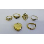 Three 9 carat gold dress rings, a gold plated heart locket and two silver dress rings (6)