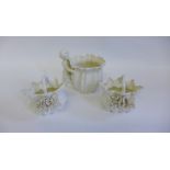 White glazed porcelain flower posy and baskets together with another with cherub (3)