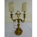 A two branch gilt metal Rococo style table lamp