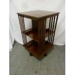 Edwardian inlaid revolving bookcase with slatted sides