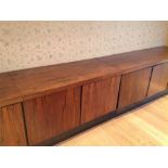 A 1970s Rosewood two section sideboard