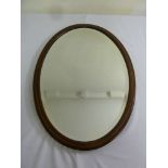 Edwardian oval wall mirror with mahogany border and satinwood inlays