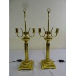 A pair of two light brass table lamps