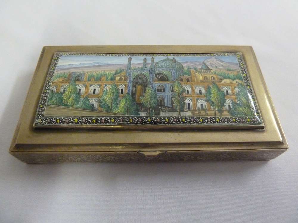 Persian white metal cigarette box, the hinged cover with an enamelled scene of a Mosque in the