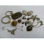 A quantity of costume jewellery to include brooches, rings and watches