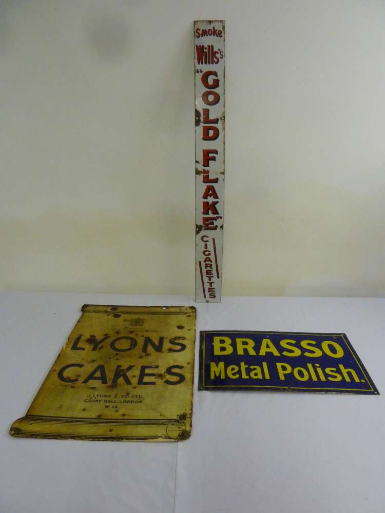 Three enamel metal signs, Lyons Cakes double sided, Wills Gold Flake and Brasso Metal Polish