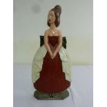 A painted metal fire guard in the form of a lady by the Birmingham guild