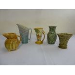 Three porcelain jugs and two vases