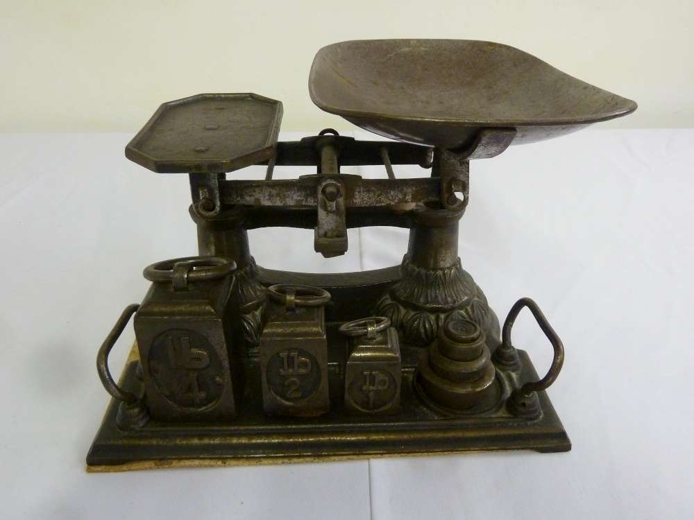 Cast iron balance scale and seven weights