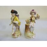 Two Continental porcelain figurines of children - marks to the base