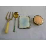 Silver and enamel spoon, a silver and enamel cigarette case, a white metal fork and a brass and