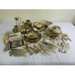 A quantity of silver plate to include a claret jug, cake dishes and flatware