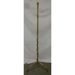 Brass lamp stand on three outswept legs of simulated bamboo form