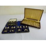 Three cased sets of silver coffee spoons and a cased set of Kings pattern silver handled fish