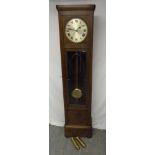 German oak long case clock circular silvered dial to include pendulum and weights circa 1930