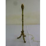 Brass table lamp of simulated bamboo form