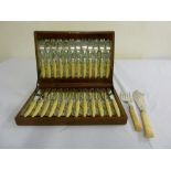 A cased set of silver plated fish eaters with matching carvers all with bone handles