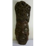 An African carved and pierced mask of a warrior - 114 x 34cm