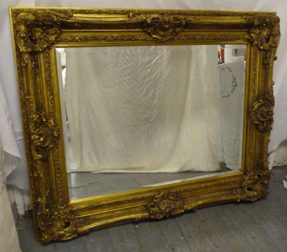 A rectangular gilt framed decorative mirror