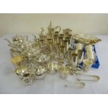 A quantity of silver plate to include a teaset, wine coaster, fruit bowls, trays and wine