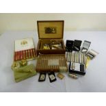 A quantity of cigars and smoking accessories to include a box of Cohiba cigars, a humidor,