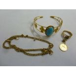 A quantity of gold jewellery to include a bangle, a chain and a ring set with a Persian gold coin (