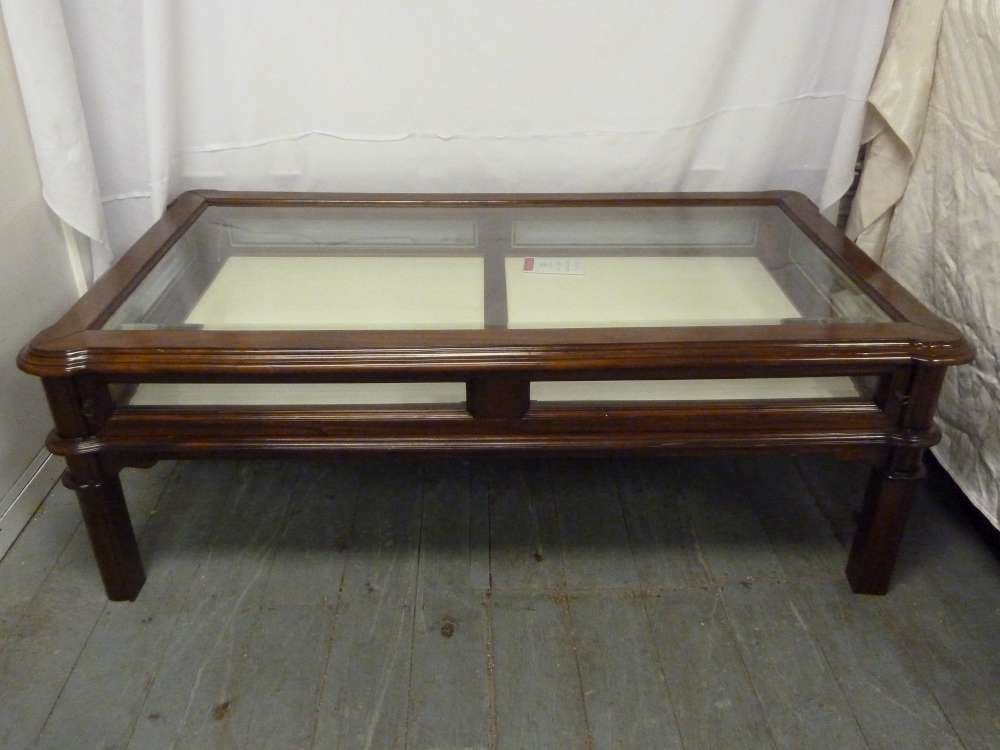 Mahogany coffee table, rectangular with glazed top and sliding drawer on four curved rectangular